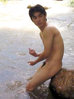 Sexy Thai guy strips in the wild