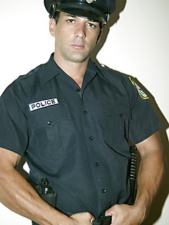 Latino cop posing