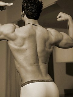 Muscled straight guy posing