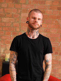 Alternative guy with tattoed and pierced body
