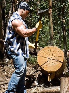 Hot hunk demonstrates hisd muscles in a forest