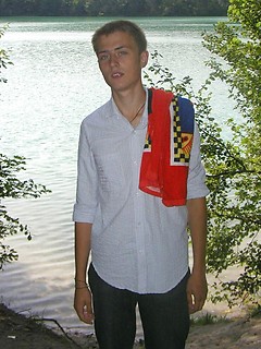 Handsome twink guy posing for the camera outdoors