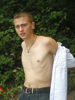 Handsome twink guy posing for the camera outdoors