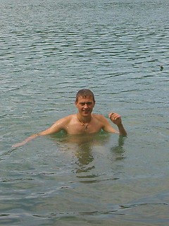 Handsome twink guy posing for the camera outdoors