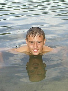 Handsome twink guy posing for the camera outdoors