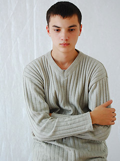 Twink grabs his crotch and poses for the camera