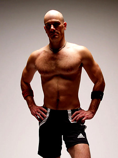 This cocky stud beats his jock-piece and shoots a herculean jizz spray across the bench