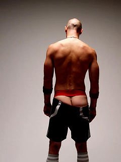 This cocky stud beats his jock-piece and shoots a herculean jizz spray across the bench