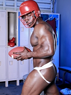 Black footbal player Adison Jay posing in locker room