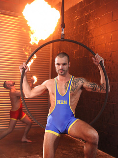 Two lycra gays have anal in circus decoration