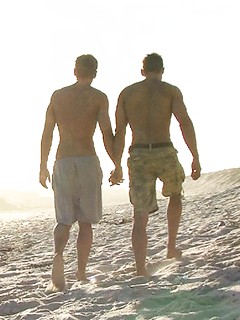 Jocks enmeshed in passionate kissing all alone on a secluded beach