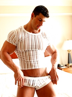 Super handsome hunk dressed in tight shirt and pants