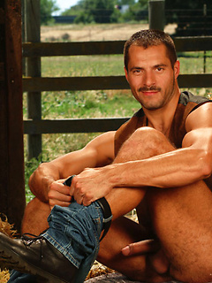 Gay cowboy relaxing at the hayloft