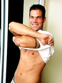 Sexy fitness model Dan Burch poses