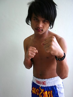 16 photos of cute gay Thai kickboxer posing and stripping