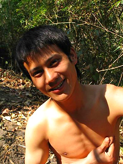 Handsome Thai guy gets naked in the wild
