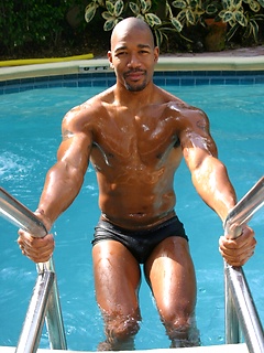 Black man posing by the pool