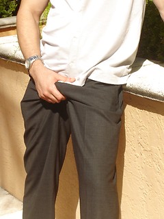 Strong latin guy posing under hot sun