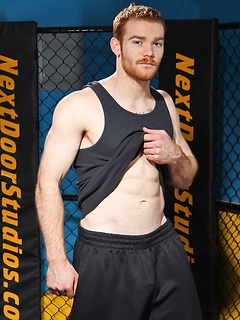 Sporty redhead dude workout in the gym