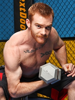 Sporty redhead dude workout in the gym