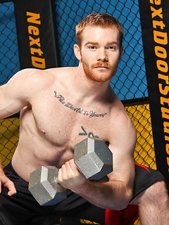 Sporty redhead dude workout in the gym