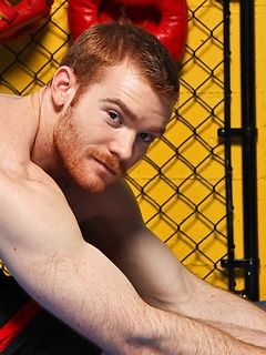 Sporty redhead dude workout in the gym