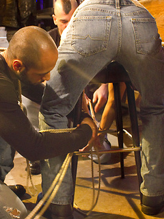 Andrew tied over a bar stool and each member of the crew take a turn on his ass