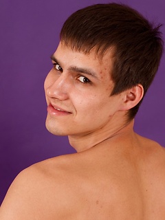 Pretty sporty straight guy is posing in white briefs and socks