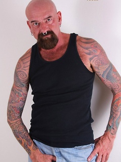 Southern bear Tex Madux is a tough tatted man that likes to fuck with his work boots on