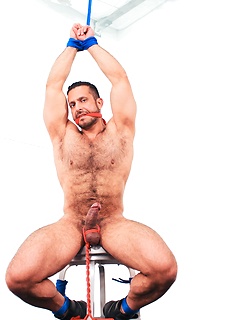 Muscular hunk tied up & cums
